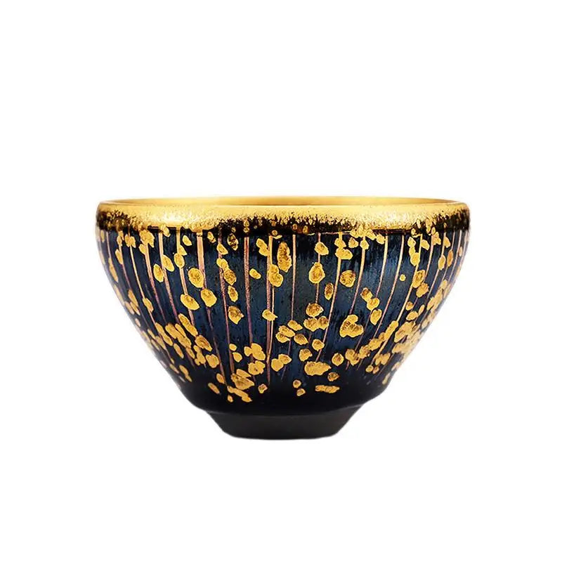 Dark blue bowl with gold accents from Golden Drops, perfect for Jian Zhan tea connoisseurs