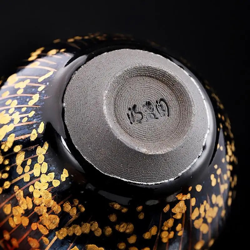 Black and gold ceramic bowl with maker’s mark for Golden Drops Jian Zhan Tea for tea connoisseurs