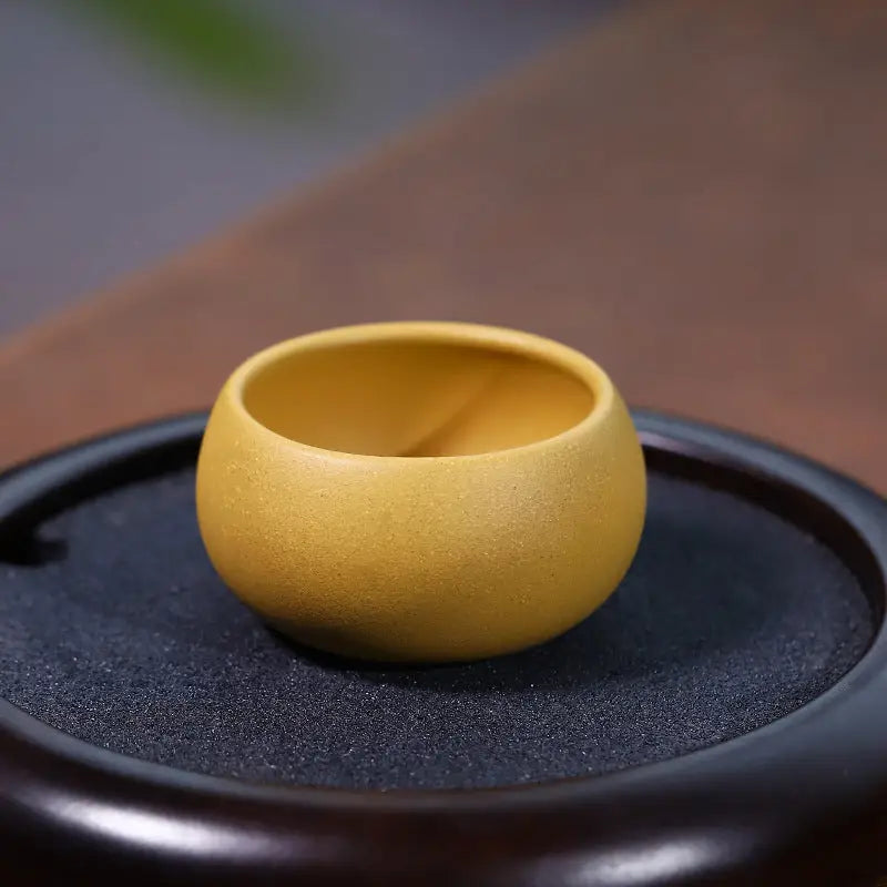 Round yellow ceramic Golden Ember Cup, perfect for Gongfu tea set enjoying Yixing Zisha style