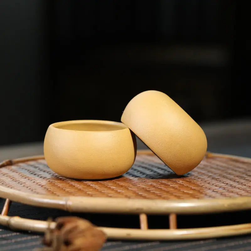 Two small tan Yixing Zisha Golden Ember Teacups for Gongfu Tea Set enjoyment