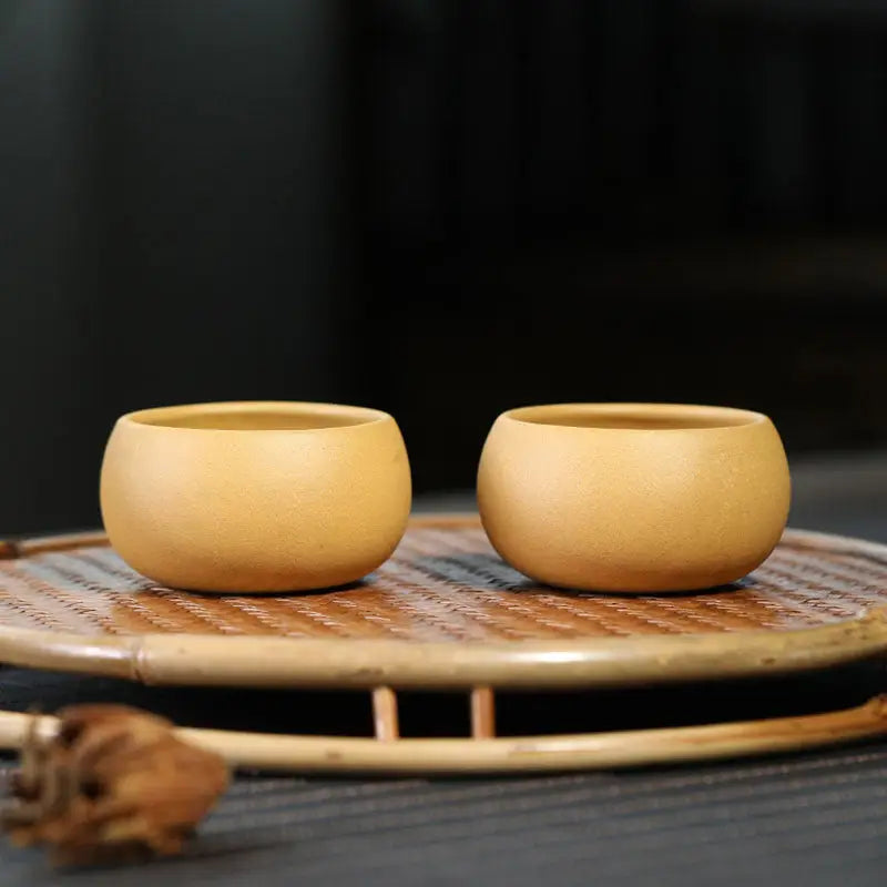 Two small yixing zisha wooden cups from the Golden Ember Teacup Gongfu Tea Set