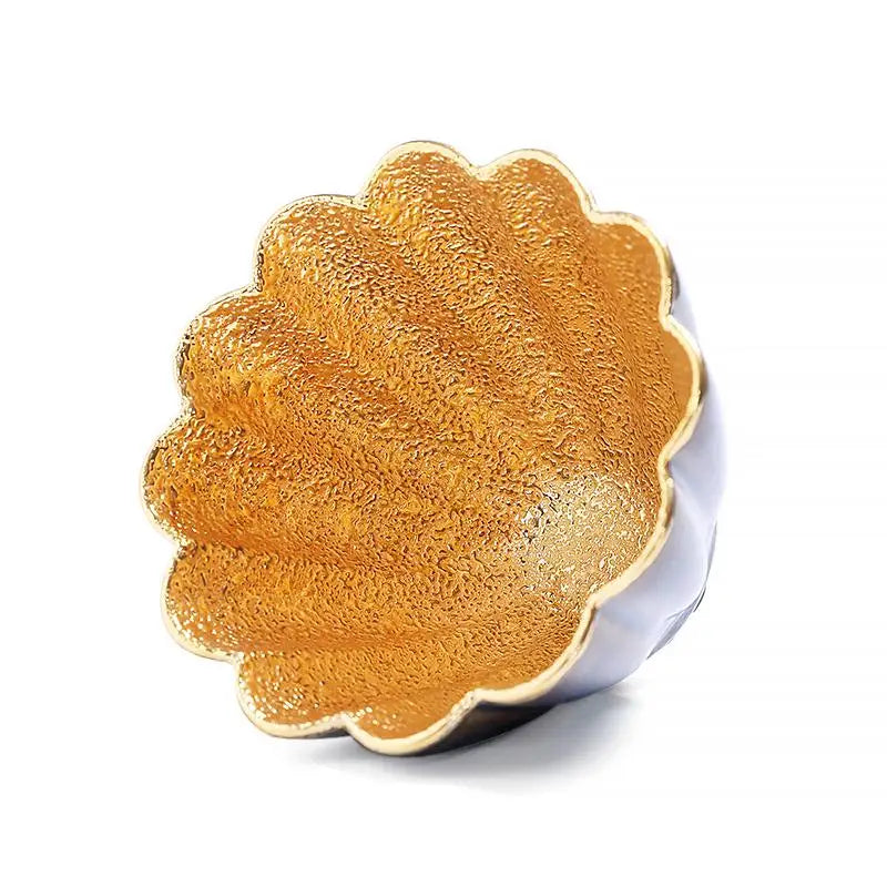 Golden Flower teacup with a gold-colored scalloped-edge bowl showcasing elegant design