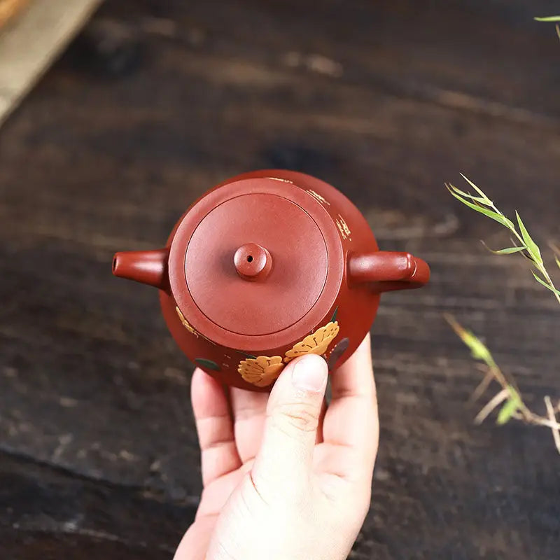 Reddish-brown ceramic Golden Ginkgo harmony yixing zisha teapot with floral design