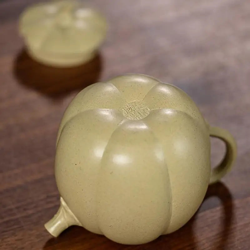 Olive-green pumpkin-shaped Yixing Duanni Teapot made from Duanni clay, part of Golden Gourd collection