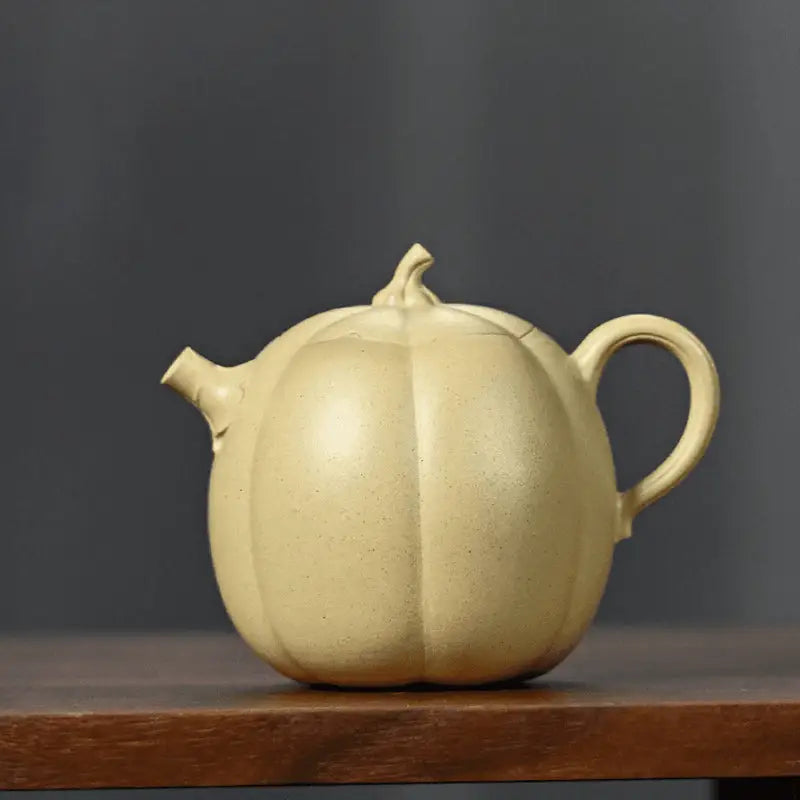 Pumpkin-shaped ceramic teapot made from duanni clay in a Yixing Zisha style for tea brewing