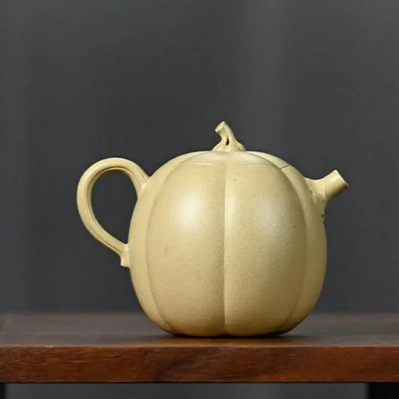 Pumpkin-shaped ceramic teapot crafted from duanni clay, ideal as a Yixing Zisha teapot