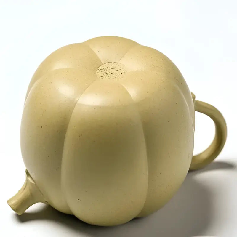 Pumpkin-shaped ceramic teapot made from duanni clay, part of the Golden Gourd Yixing Zisha collection