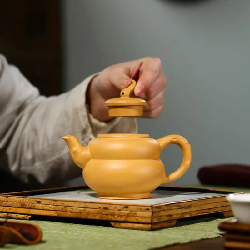 Yellow ceramic teapot with lid made of Duanni clay for Gongfu tea brewing