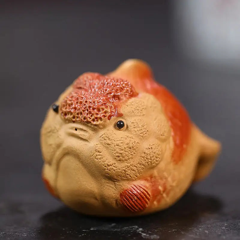 Ceramic lionhead goldfish figurine from Golden Guardian, perfect as a goldfish tea pet