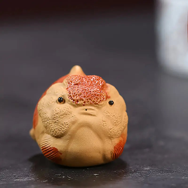 Ceramic lionhead goldfish figurine from the Golden Guardian goldfish tea pet collection