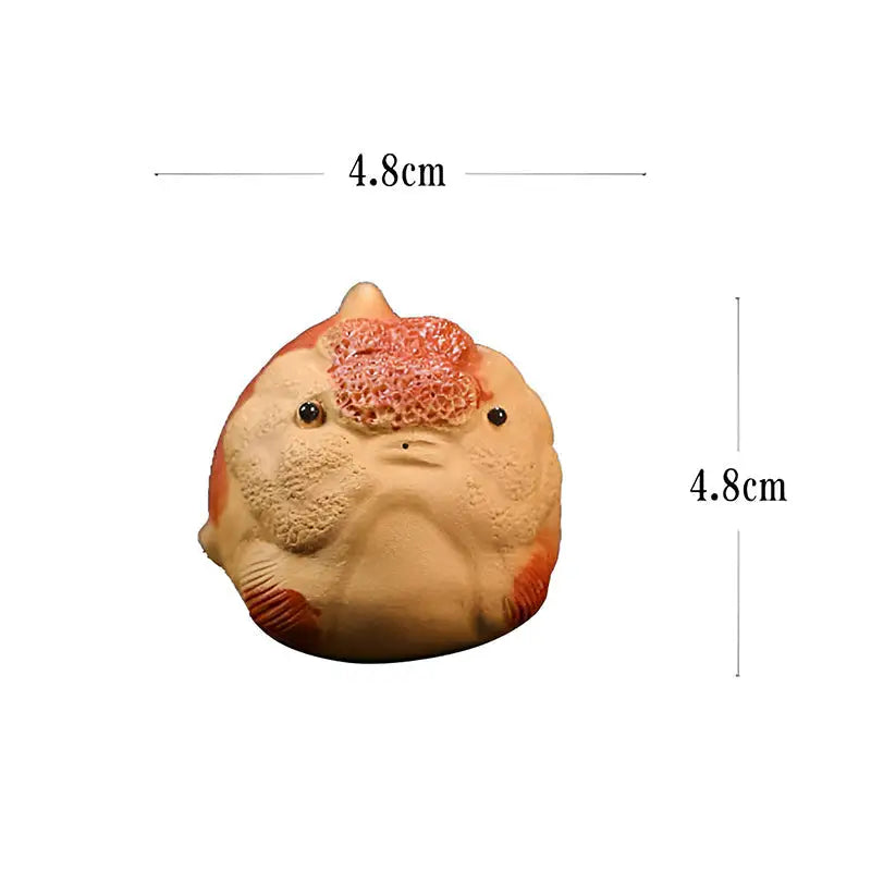 Round ceramic lionhead goldfish tea pet figurine from Golden Guardian product line