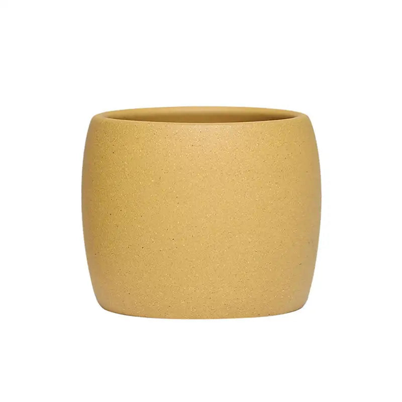 Round tan-colored ceramic pot in Golden Harmony made from yellow Duanni clay Yixing Zisha