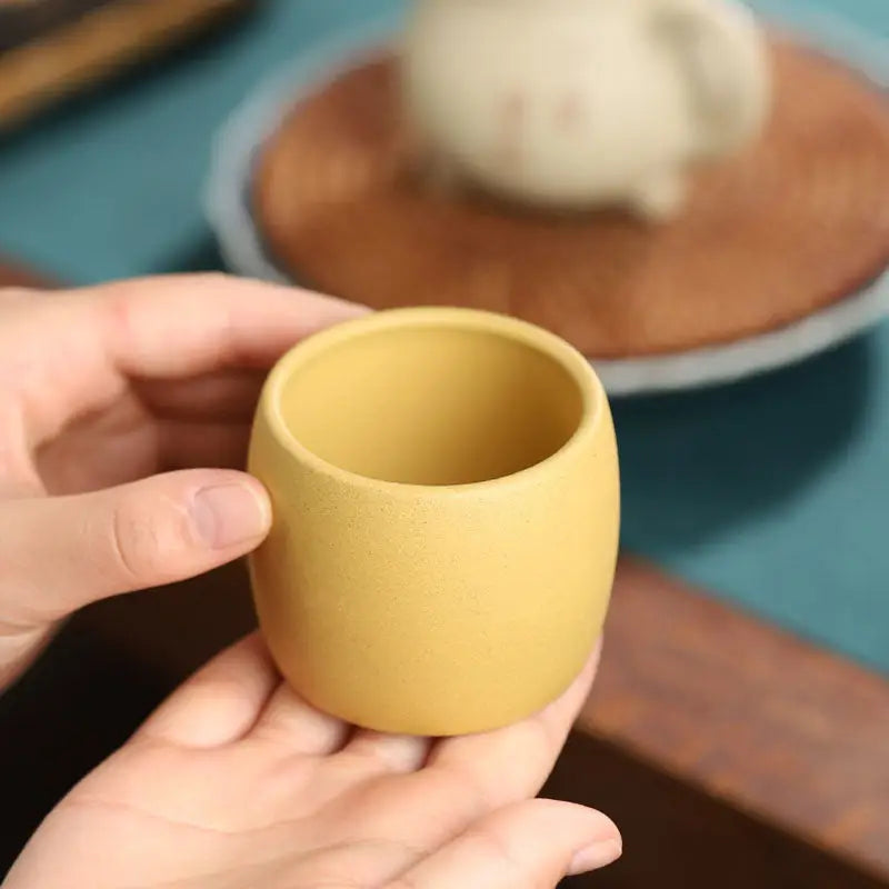 Yellow Duanni clay ceramic cup from Golden Harmony Yixing Zisha collection