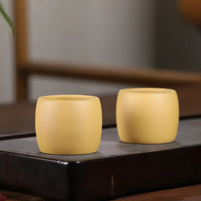 Yellow Duanni Clay ceramic cups from Golden Harmony collection featuring Yixing Zisha craftsmanship