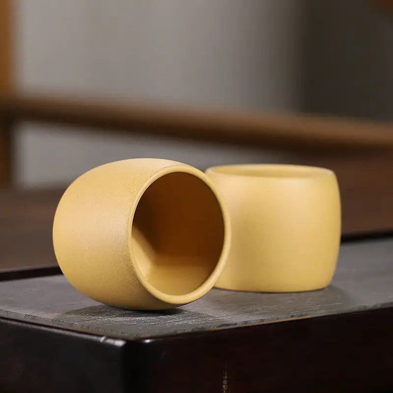 Yellow Duanni Clay Ceramic Cups from Golden Harmony display in Yixing Zisha style