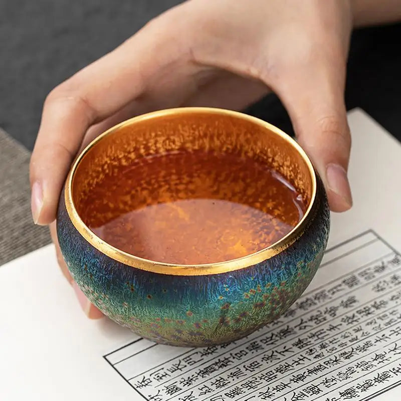 Iridescent tea cup with golden interior from Golden Magic for Jian Zhan Tea and magic Jian Zhan