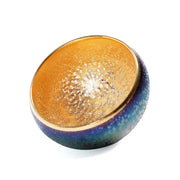 Iridescent blue and gold decorative bowl from Golden Magic featuring Jian Zhan tea design