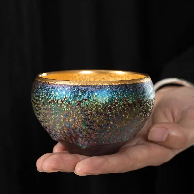 Iridescent ceramic teacup with gold rim from Golden Magic for Jian Zhan Tea and magic Jian Zhan