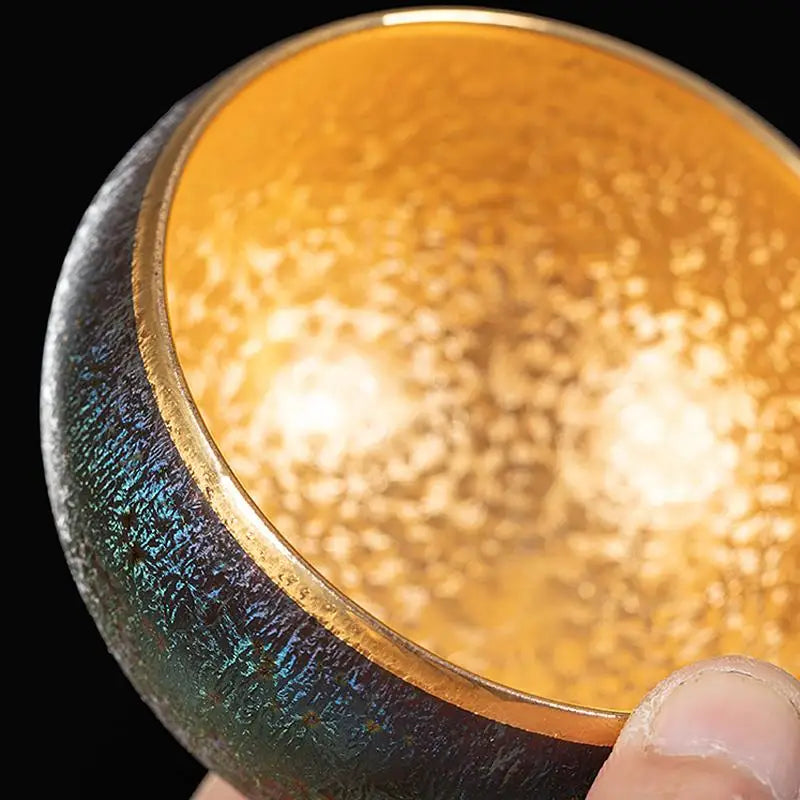 Golden lined iridescent bowl from Golden Magic, perfect for Jian Zhan tea rituals