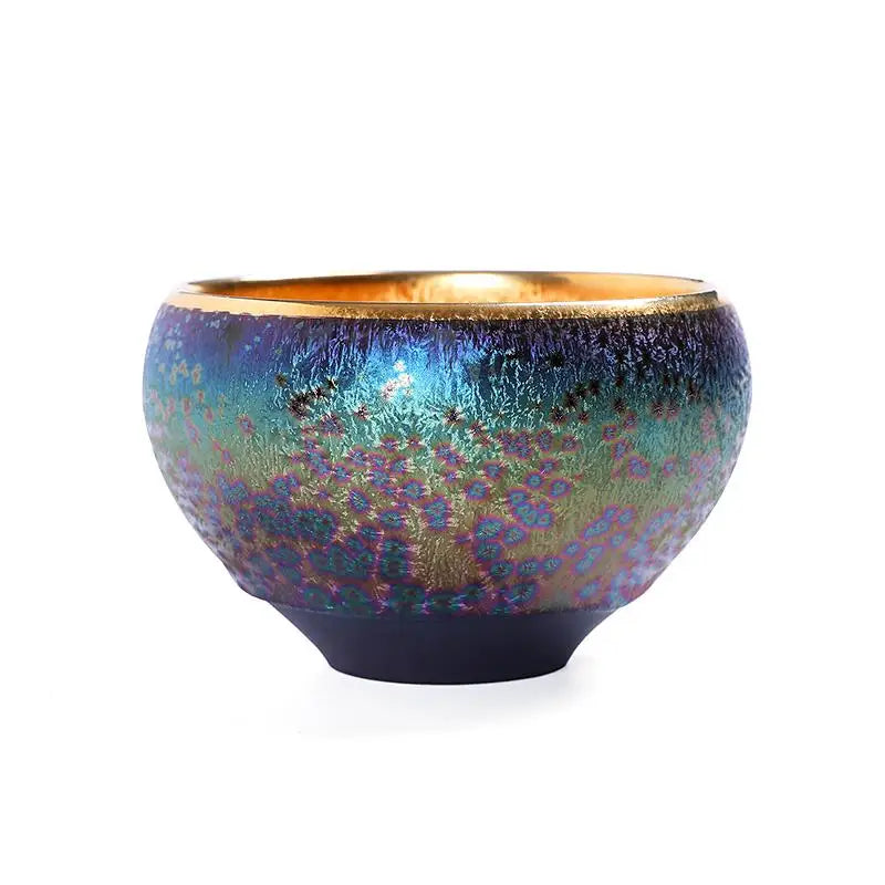 Iridescent ceramic bowl with gold rim from Golden Magic, perfect for Jian Zhan tea
