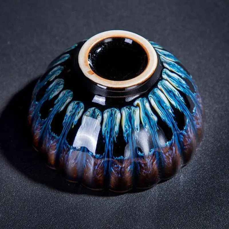 Ornamental ceramic bowl with blue and brown glaze for Golden Peacock Tenmoku Zhan Tea