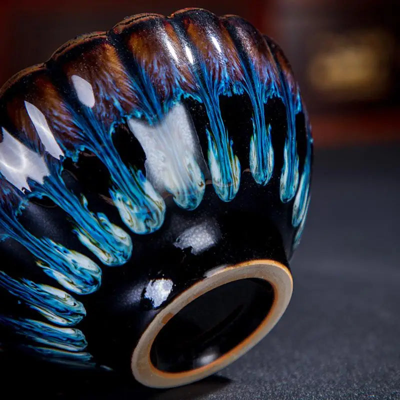 Glazed ceramic Golden Peacock Tenmoku Jian Zhan tea cup with fluted design for Zhan tea