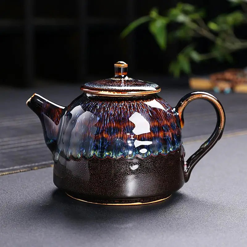 Golden Peacock Jian Zhan teapot with iridescent oil-spot glaze and ceramic finish