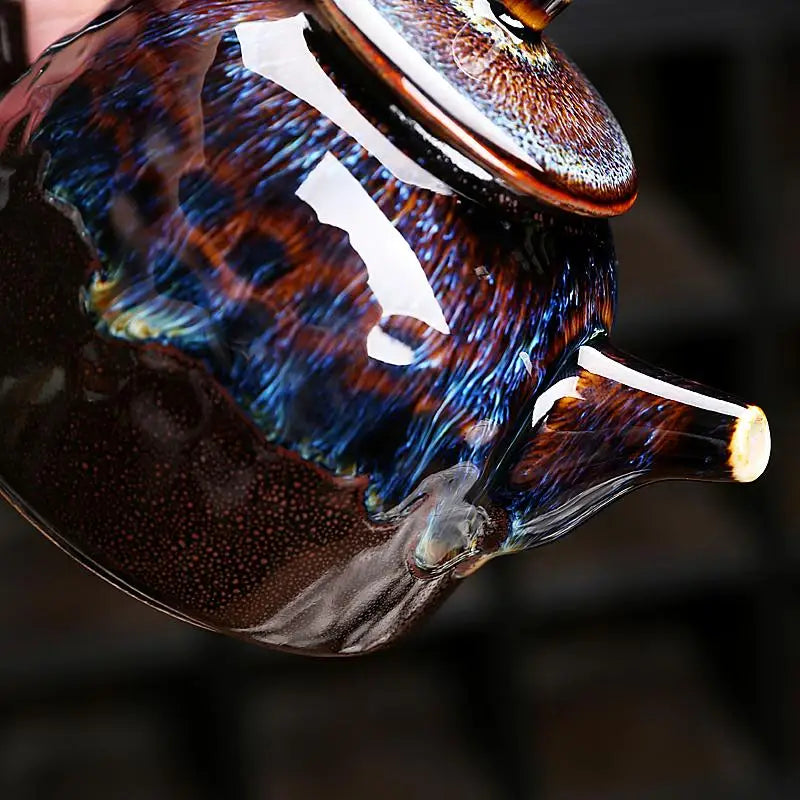 Glossy multicolored Golden Peacock Jian Zhan teapot with oil-spot glaze design
