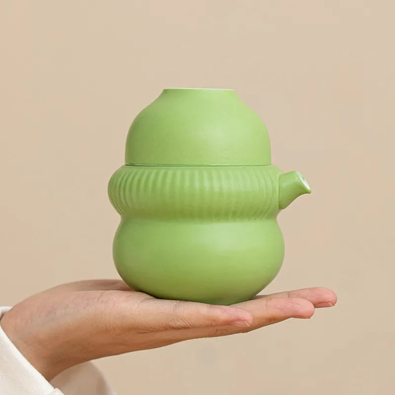 Gourd-shaped porcelain kuaike travel tea set with two cups and padded zip case – photo 3