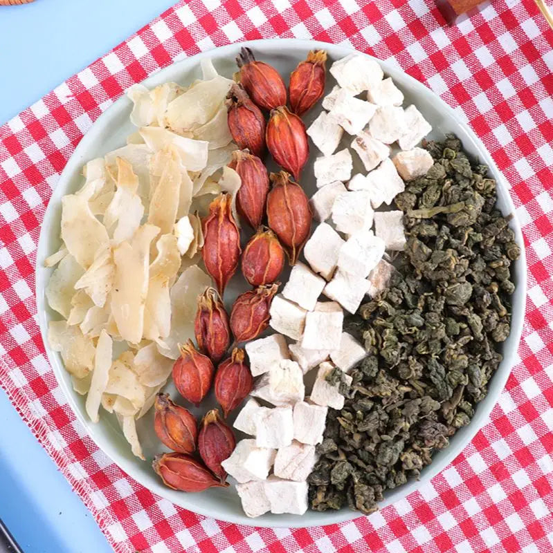 Assorted dried ingredients including Poria Cocos and Coix Seed for anti-inflammatory Gout Tea