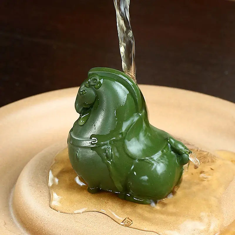 Green Gallop horse tea pet being watered, perfect for gongfu tea enthusiasts