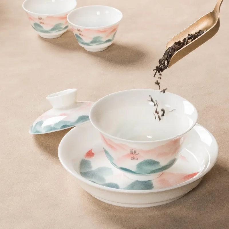 Jade-white gaiwan with pink and teal famille rose mountain landscape – photo 3