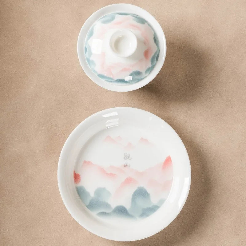Jade-white gaiwan with pink and teal famille rose mountain landscape – photo 4