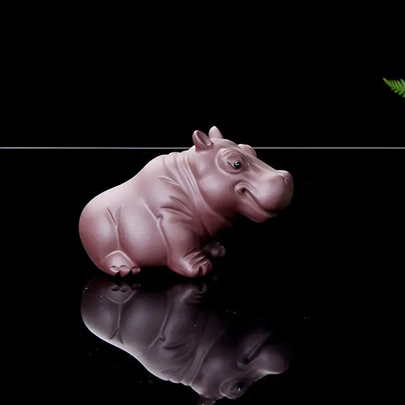Pink hippo figurine from Guardian of Still Waters, a charming hippopotamus tea pet for Yixing clay tea and feng shui pets guide