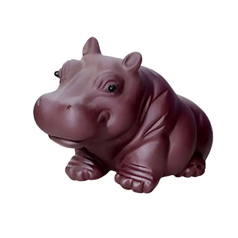 Maroon hippopotamus figurine from Guardian of Still Waters, a Yixing clay tea pet for feng shui