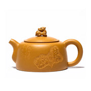 Yixing teapot with guardian beast lid made of golden duanni clay