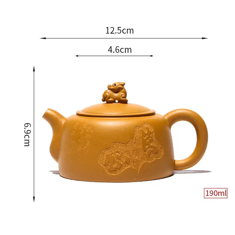 Yellow-brown Yixing teapot with guardian beast lid crafted from golden duanni clay
