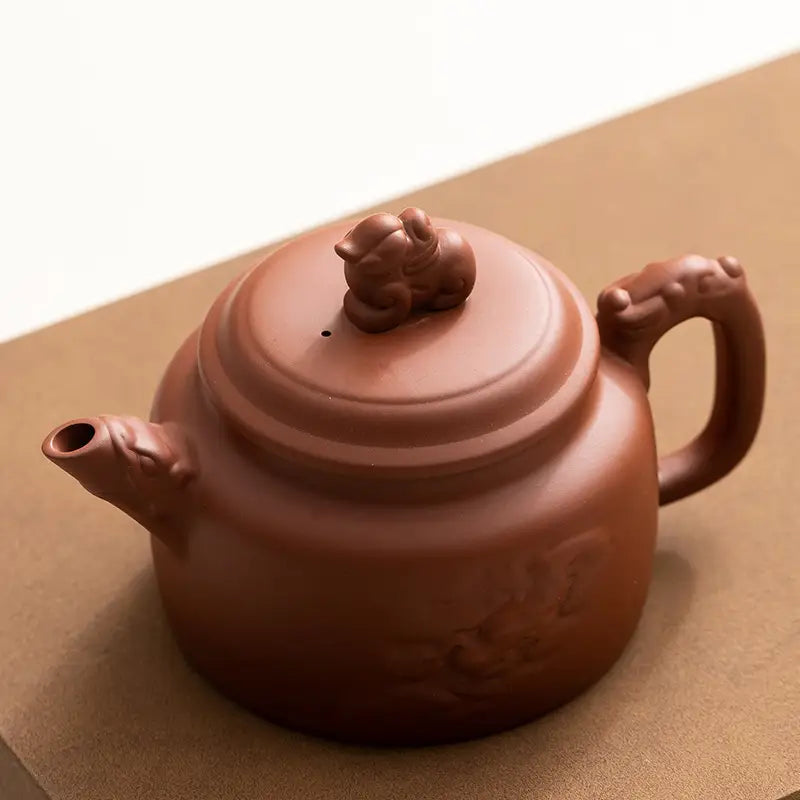Brown clay teapot with animal lid from Guardian Spirit Tea Set, handcrafted Yixing Zisha