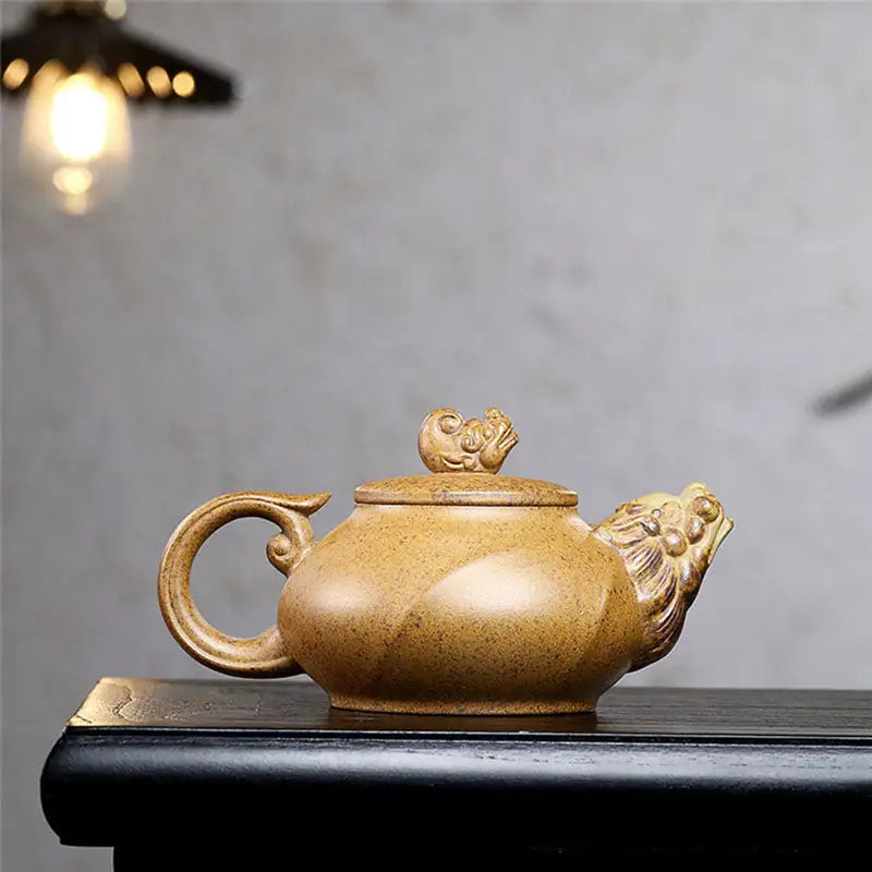 Ornate speckled Tan Yixing Teapot with Lion Head Spout in Guardian Spirit collection