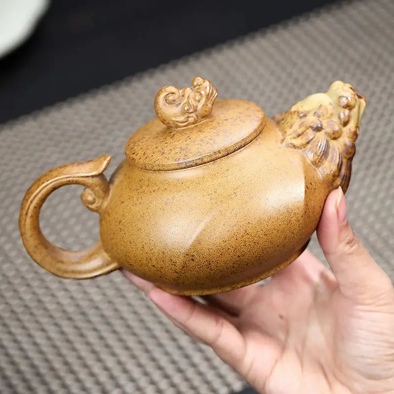 Ornate brown Yixing teapot with lion head spout made from duanni clay for Guardian Spirit
