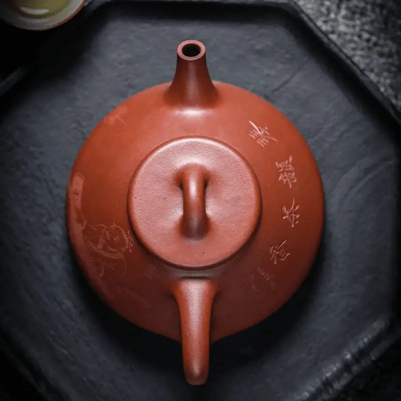 Reddish-brown Yixing Zisha Teapot from Guqin Reverie with rounded body and cylindrical spout