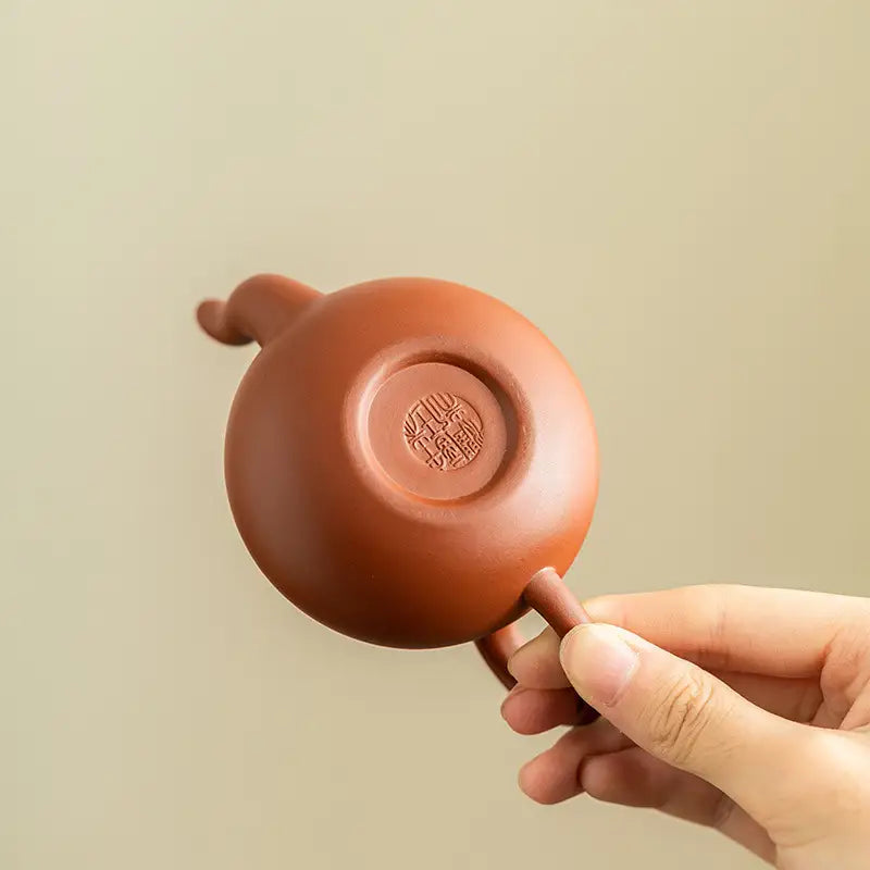 Reddish-brown Yixing Zisha teapot from the Harmony Bloom Tea Set for exquisite tea brewing