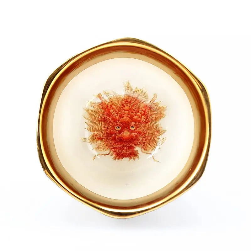 Golden-rimmed bowl with a red dragon design from Harmony tea sets with gilded interior