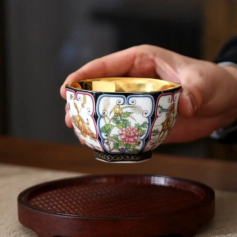 Ornate porcelain teacup with gilded interior from the Harmony tea set