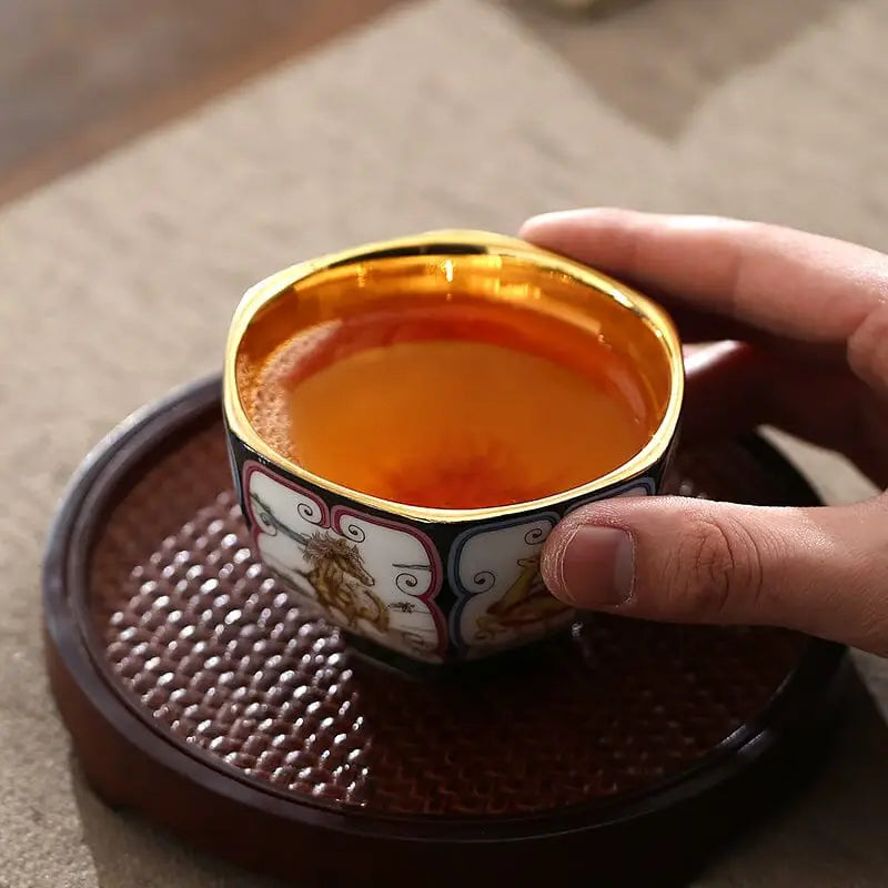Ornate Harmony tea cup with gilded interior and golden rim, part of elegant tea sets