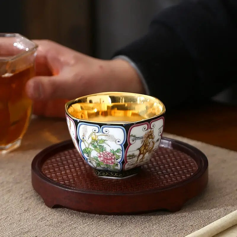 Elegant ornate tea cup with gilded interior from the Harmony tea set, perfect for stylish teapots