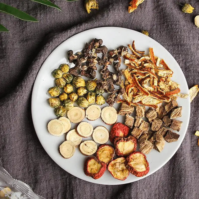 Assorted dried herbal ingredients including hovenia dulcis and tangerine peel with volatile oils
