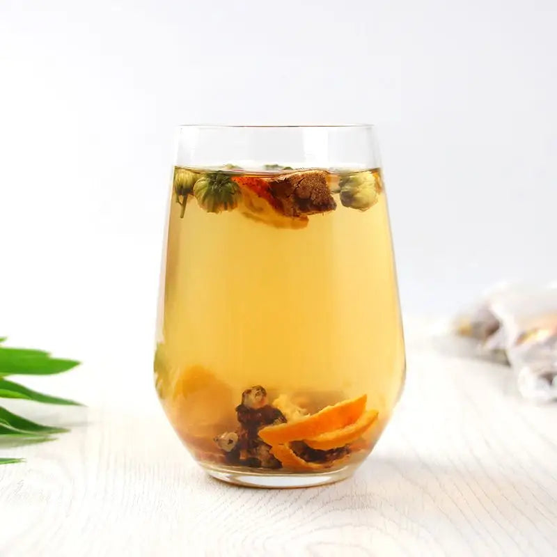 Herbal tea with Hovenia Dulcis and Tangerine Peel showcasing volatile oils in a glass