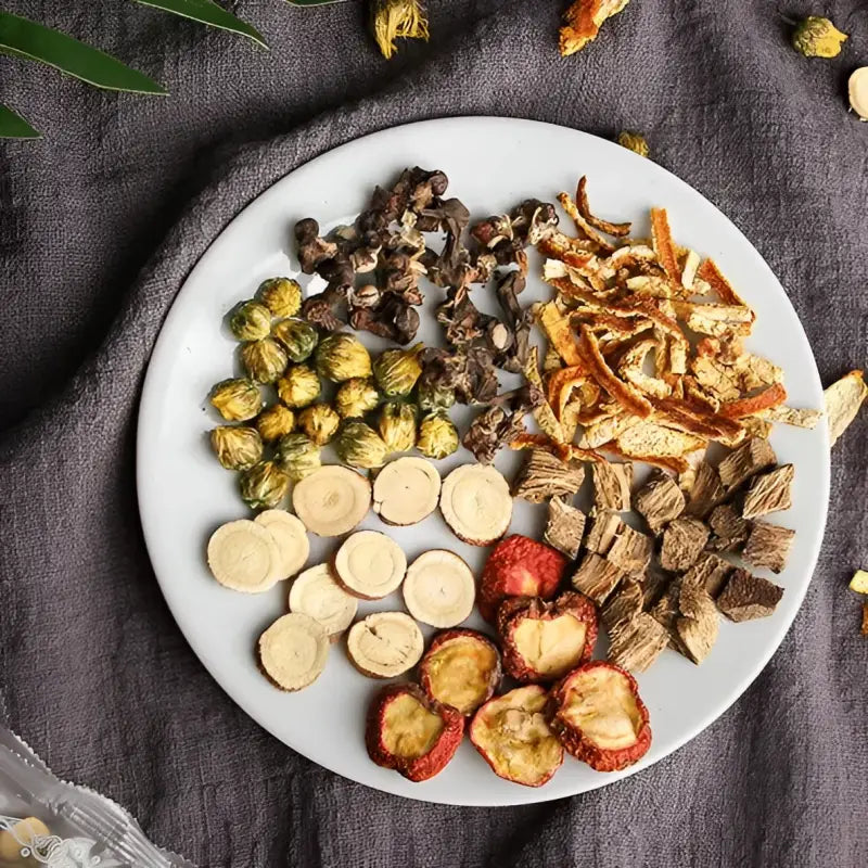 Assorted dried herbal ingredients including hovenia dulcis and tangerine peel with volatile oils