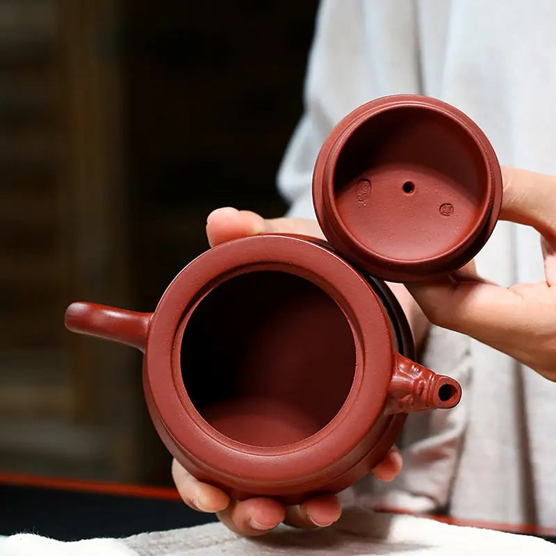 Reddish-brown Yixing Zisha clay teapot with open lid from Heaven’s Mandate collection